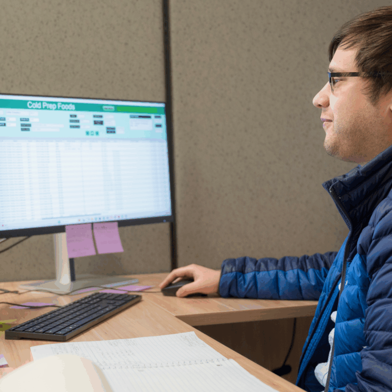 Team member showing tagger system spreadsheet for Cold Prep
