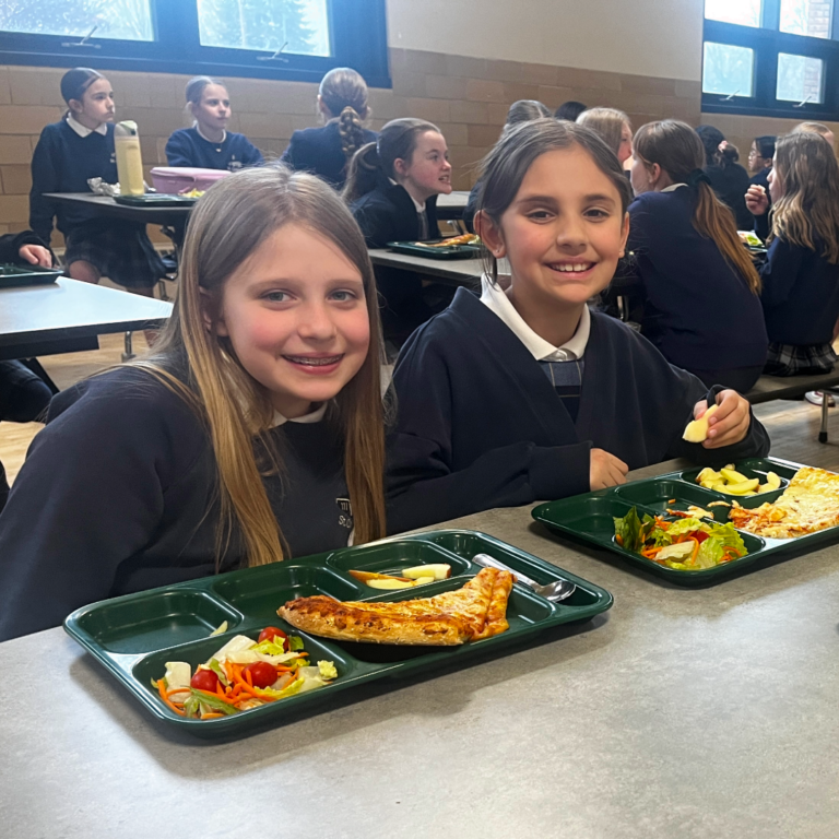 kids eating lunch, pizza day at St. Charles