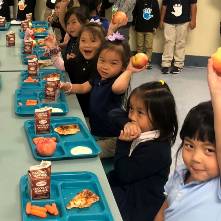 Kids eating apples during the Great Apple Crunch